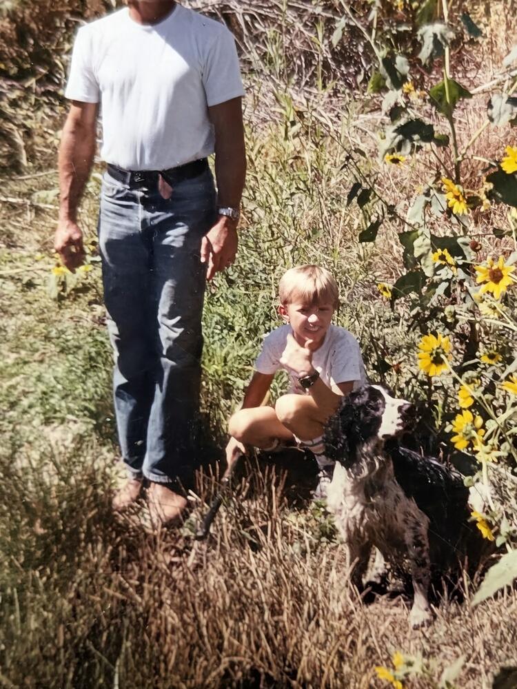 Three generations in the field — with the family dog