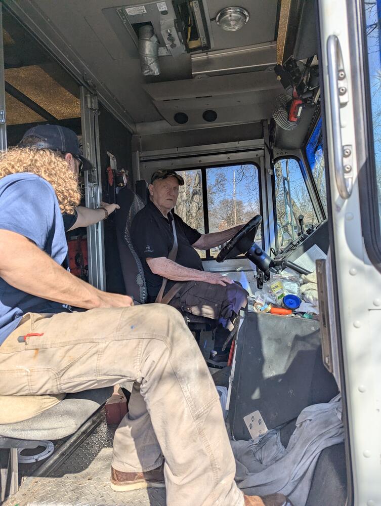 Stephen at the wheel of the work truck