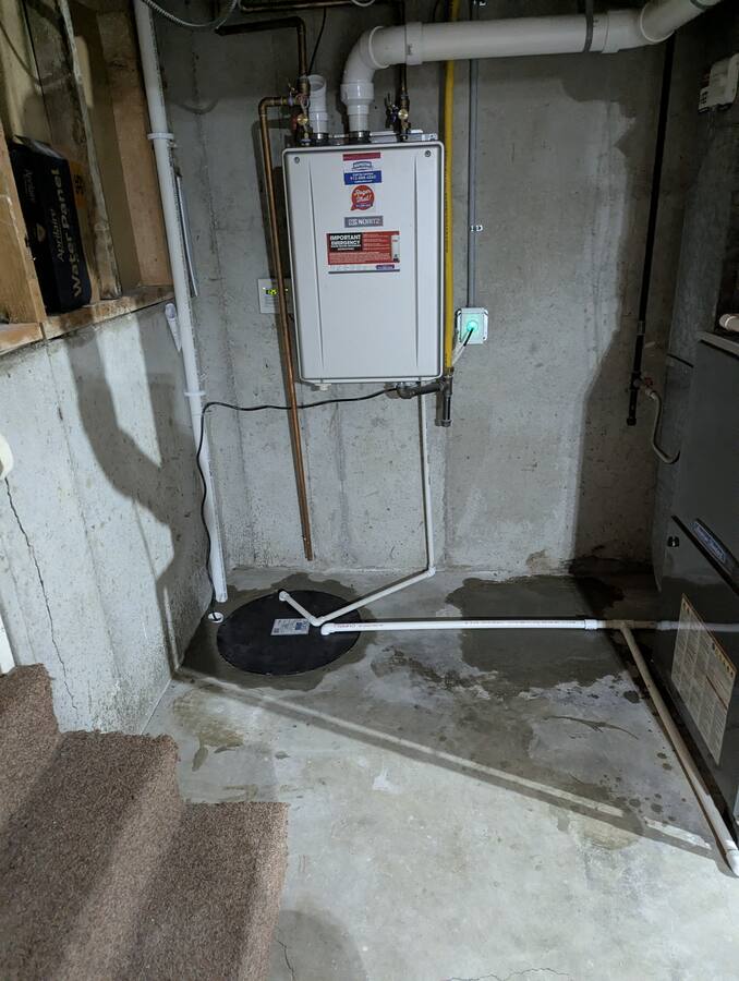 Sump near tankless water heater — proper separation from sanitary drains