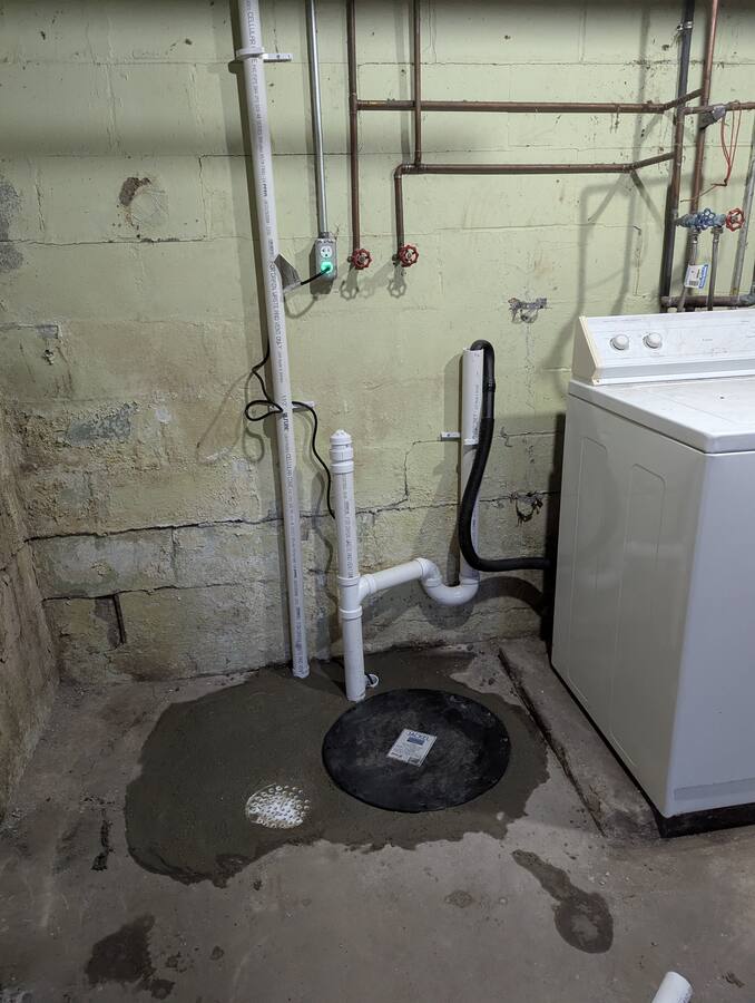 Washer standpipe and sump discharge kept independent of the sewer