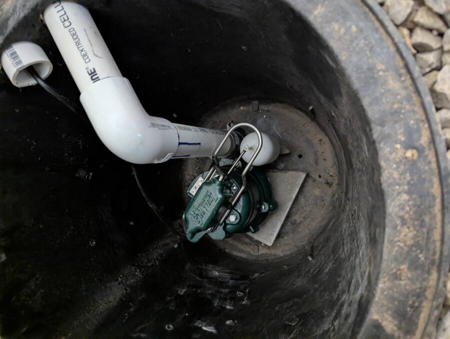 Close-up of sump pump and float switch in the basin