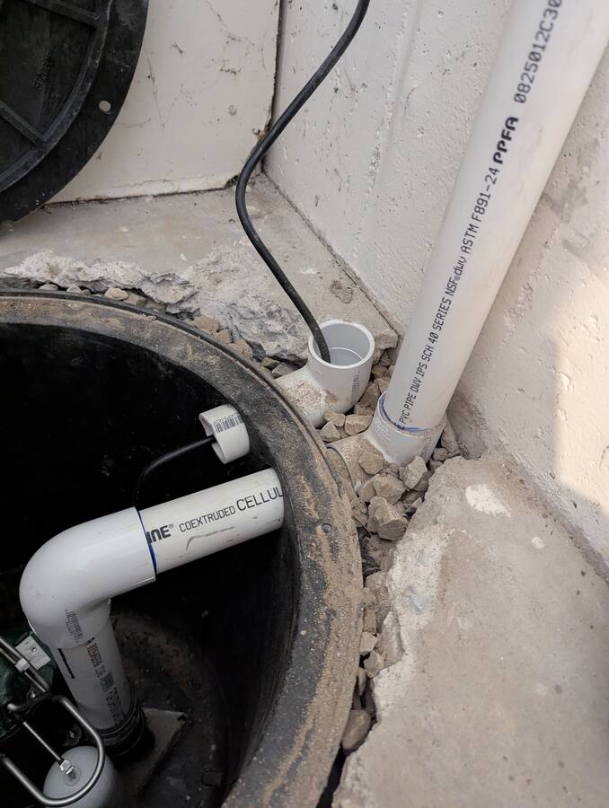 Cord and discharge penetrations detailed at the basin rim