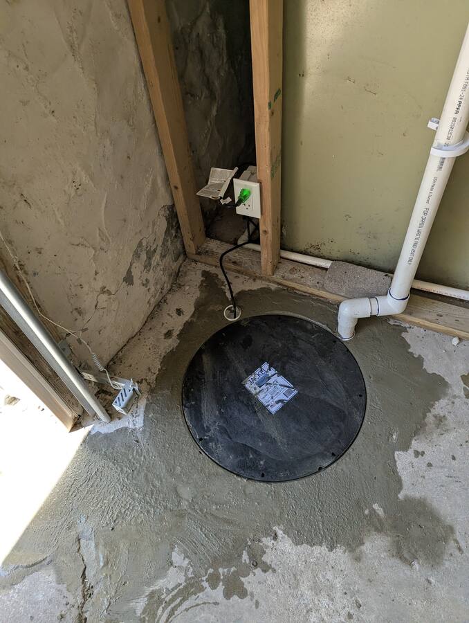 Finished sealed sump installation with dedicated outlet