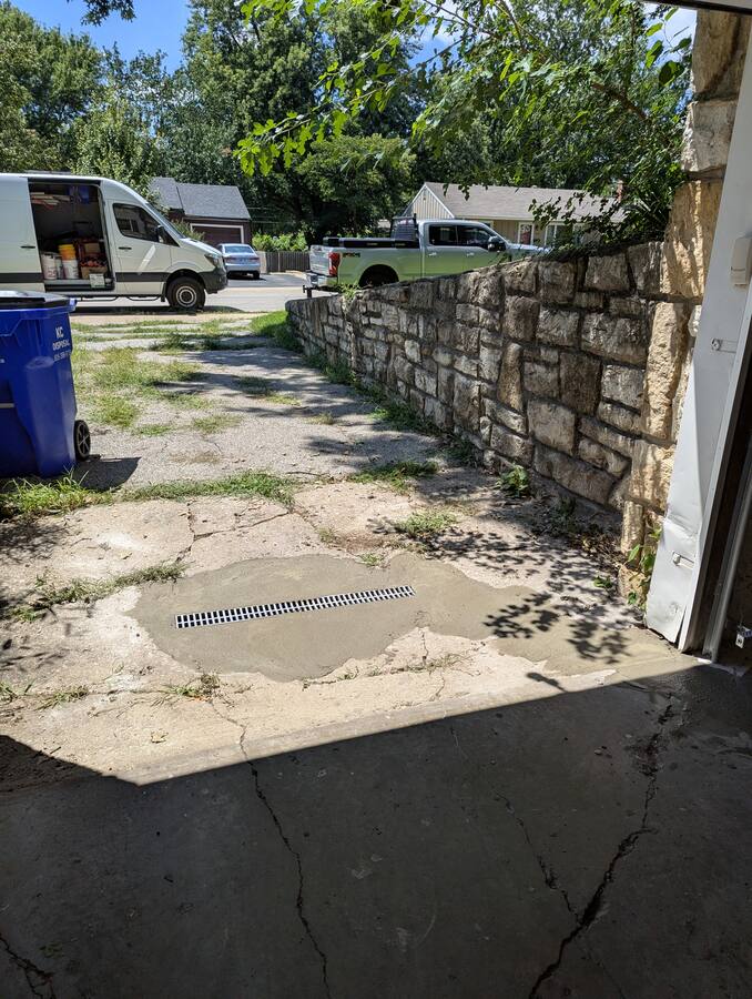 New area drain in concrete — keeps surface water out of the sanitary system